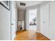 Bright hallway with wood floors and closet space leads to an exercise room at 2770 Da Vinci Cres, Decatur, GA 30034