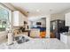 Kitchen with granite countertops and a view to a bright living room with hardwood floors at 2770 Da Vinci Cres, Decatur, GA 30034