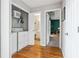 Convenient laundry area with washer and dryer, with hardwood floors and a doorway to the bathroom at 2770 Da Vinci Cres, Decatur, GA 30034
