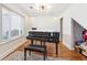Elegant living room featuring a grand piano and hardwood floors at 2770 Da Vinci Cres, Decatur, GA 30034