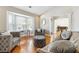 Comfortable living room with hardwood floors, bay window, and stylish gray furnishings at 2770 Da Vinci Cres, Decatur, GA 30034