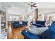 Open-concept living room boasts hardwood floors, a vaulted ceiling, and a comfortable blue sectional sofa at 2770 Da Vinci Cres, Decatur, GA 30034