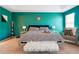 Bright main bedroom showcasing a statement wall color, soft carpet, and tasteful decor at 2770 Da Vinci Cres, Decatur, GA 30034
