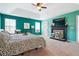 Spacious main bedroom with fireplace, TV, and bright windows creates a welcoming retreat at 2770 Da Vinci Cres, Decatur, GA 30034