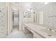 Charming bathroom featuring dual sinks, butterfly wallpaper, and ample closet space at 303 Brandywine Cir, Atlanta, GA 30350