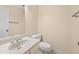 Powder room featuring a white toilet and vanity with an oval sink at 303 Brandywine Cir, Atlanta, GA 30350