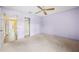 Light-filled bedroom with a ceiling fan and neutral carpet at 303 Brandywine Cir, Atlanta, GA 30350