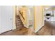 Inviting entryway with hardwood flooring and a view of the kitchen and staircase at 303 Brandywine Cir, Atlanta, GA 30350