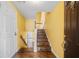 Foyer featuring hardwood floors, a white entry door, and a view of the stairway at 303 Brandywine Cir, Atlanta, GA 30350
