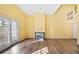Bright living room with fireplace, hardwood floors, and natural light from sliding glass doors at 303 Brandywine Cir, Atlanta, GA 30350