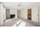 Cozy living room with built-in bookshelves, a fireplace, and natural light at 303 Brandywine Cir, Atlanta, GA 30350