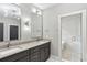 Bathroom featuring double sinks, modern fixtures, and a glass shower at 346 Langford Dr, Norcross, GA 30071