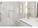 Modern bathroom showcasing a glass enclosed shower, marble walls, and stylish fixtures at 346 Langford Dr, Norcross, GA 30071