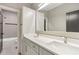 Bathroom featuring double sinks, modern fixtures, and a separate shower and bath at 346 Langford Dr, Norcross, GA 30071