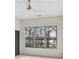 Bedroom with a view of trees out of a large window and a ceiling fan at 346 Langford Dr, Norcross, GA 30071