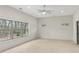 Open bedroom with hardwood floors, recessed lighting, and large windows showing outside trees at 346 Langford Dr, Norcross, GA 30071