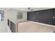 A bonus room with black accent wall and hardwood floors at 346 Langford Dr, Norcross, GA 30071