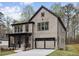 Modern two-story home with a large garage and well-manicured lawn at 346 Langford Dr, Norcross, GA 30071