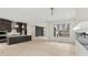 A modern kitchen with dark brown cabinets, stainless steel appliances, hardwood floors and marble countertops at 346 Langford Dr, Norcross, GA 30071