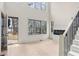 Bright living room showcasing hardwood floors, a staircase, and large windows offering natural light at 346 Langford Dr, Norcross, GA 30071