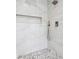 The shower is decorated with pebble flooring and large porcelain tiles at 346 Langford Dr, Norcross, GA 30071