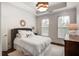 Bedroom featuring natural light, a neutral color palette, and stylish decor at 45 Honour Nw Ave, Atlanta, GA 30305