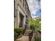 Brick townhome with manicured landscaping and inviting entrance at 45 Honour Nw Ave, Atlanta, GA 30305
