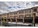 Brick townhomes featuring individual balconies and attached garages at 45 Honour Nw Ave, Atlanta, GA 30305