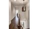 Hallway with hardwood floors, white trim, and a modern light fixture at 45 Honour Nw Ave, Atlanta, GA 30305