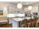 Eat-in kitchen featuring a marble counter island, stainless steel appliances, and pendant lighting at 45 Honour Nw Ave, Atlanta, GA 30305