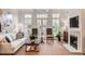 Bright living room features a fireplace, large windows, and comfortable seating at 45 Honour Nw Ave, Atlanta, GA 30305