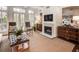 Bright living room features a fireplace, large windows, and comfortable seating at 45 Honour Nw Ave, Atlanta, GA 30305