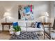 Stylish living room with modern decor, featuring a comfortable sofa, accent pillows, and eye-catching artwork at 45 Honour Nw Ave, Atlanta, GA 30305