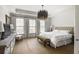 Relaxing bedroom with neutral tones, tray ceiling, and large windows at 45 Honour Nw Ave, Atlanta, GA 30305