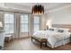 Serene bedroom with large windows, tray ceiling, and comfortable seating area at 45 Honour Nw Ave, Atlanta, GA 30305