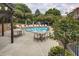 Community pool with tables, chairs and beautiful trees surrounding at 45 Honour Nw Ave, Atlanta, GA 30305