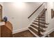 Elegant staircase with dark wood treads, white risers and walls at 45 Honour Nw Ave, Atlanta, GA 30305