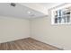 Basement room with a window providing natural light and stylish flooring, perfect for various uses at 1937 Joseph Ct, Decatur, GA 30032