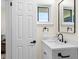 Bathroom featuring a modern vanity with matte black hardware, a sleek mirror, and a bright window at 1937 Joseph Ct, Decatur, GA 30032
