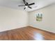 Bedroom with hardwood floors, a ceiling fan, and a large window for natural light at 1937 Joseph Ct, Decatur, GA 30032