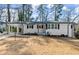 Charming white brick ranch-style home with a covered carport and freshly landscaped front yard at 1937 Joseph Ct, Decatur, GA 30032