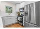 Bright kitchen with white cabinets, stainless steel appliances, and a view from the window at 1937 Joseph Ct, Decatur, GA 30032