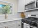 Updated kitchen featuring white cabinets, stainless steel appliances, and modern fixtures at 1937 Joseph Ct, Decatur, GA 30032
