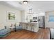 Eat-in kitchen features stainless steel appliances, bar seating, and white cabinets at 1937 Joseph Ct, Decatur, GA 30032