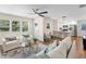 Open-concept living space flowing into the kitchen, with hardwood floors and ample natural light at 1937 Joseph Ct, Decatur, GA 30032