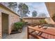 Private brick-walled backyard with a small patio for outdoor dining and entertaining at 3346 Stonecrest Ct, Atlanta, GA 30341