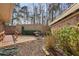 Private brick-walled backyard with a small patio for outdoor dining and entertaining at 3346 Stonecrest Ct, Atlanta, GA 30341