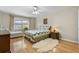 Relaxing bedroom with hardwood floors, natural light, and comfortable furnishings at 3346 Stonecrest Ct, Atlanta, GA 30341