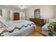 Comfortable primary bedroom with wood floors, traditional furnishings and ensuite access at 3346 Stonecrest Ct, Atlanta, GA 30341