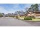 Neighborhood street view showcasing well-maintained homes and landscaping within a tranquil community setting at 3346 Stonecrest Ct, Atlanta, GA 30341